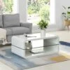 Lucent White High Gloss And Glass Shelf Coffee Table 1 Lucent White High Gloss And Glass Shelf Coffee Table -FINZ Furniture Shop e1a9f08f 4407 4af4 8e05 33cce4ac83f7